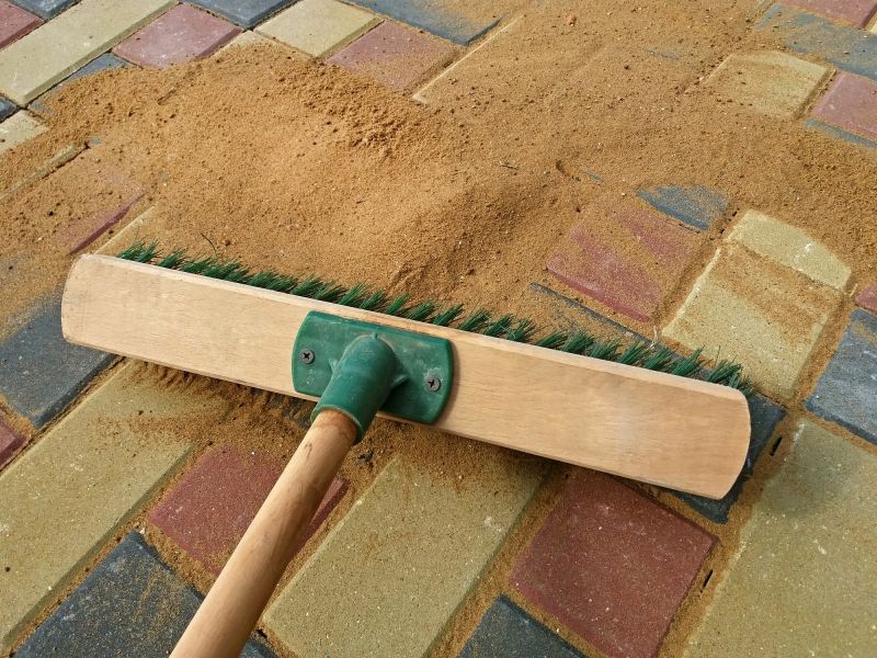 Jointing sand being spread